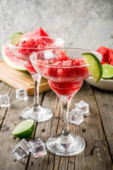 Sweet summer watermelon and lime granita with sliced watermelon and mint, on white marble background copy space