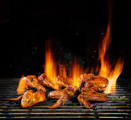 Various chicken meat being grilled, isolated on black © Jag_cz