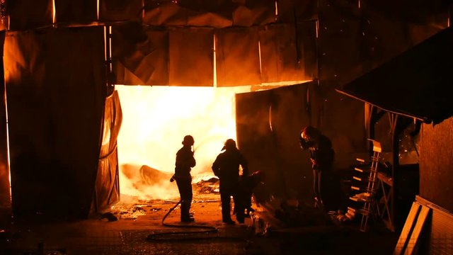 Firefighters Stopping A Burning Warehouse