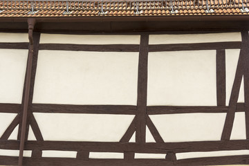 Roof and facade of a house with typical half timbered style.