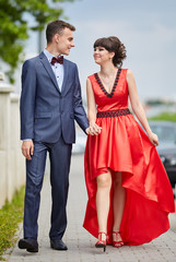 Elegant couple walking in the park