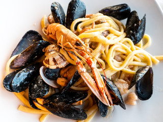 plate of pasta with mixed fresh fish