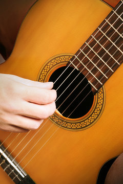 Acoustic guitar strings. Classical guitarist hands