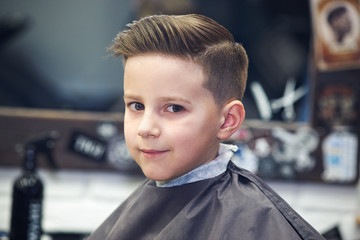 European boy in a barber shop. Ready work. - 210462729