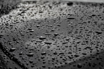 Brilliant raindrops on a car in cloudy weather