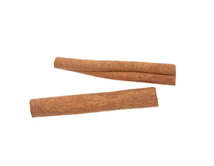 two cinnamon sticks on a white background