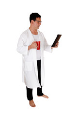 Tall man standing in bathrobe and coffee mug