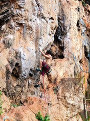 Young strong guy climbing / leading topless in Thailand - Krabi, Tonsai Beach