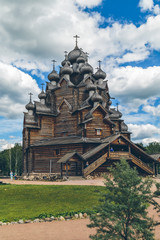 Fototapeta na wymiar ancient wooden church in Russia in summer day