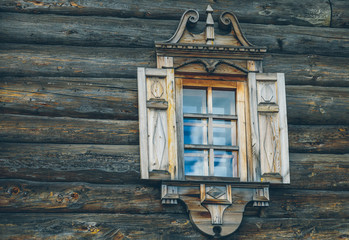 old window on a wooden wall