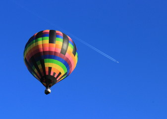 Hot Air Balloon with Plane flying Over