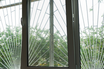 Protective grid on the window. Texture. Protection from thieves concept.