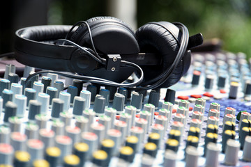 Obraz na płótnie Canvas Music mix console and headphones on it
