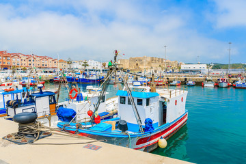 Colorful fishing boats anchoring in the Andalusian town of Tarifa, Costa de la Luz, Spain