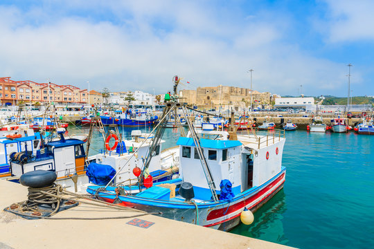 Colorful fishing boats anchoring in the Andalusian town of Tarifa, Costa de la Luz, Spain