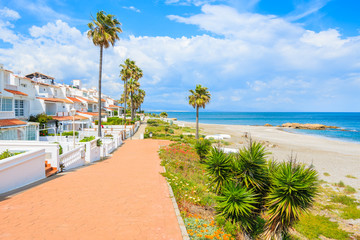 Path along beautiful beach in small coastal village near Marbella on Costa de Sol, Spain