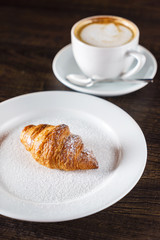 fresh croissant and coffee