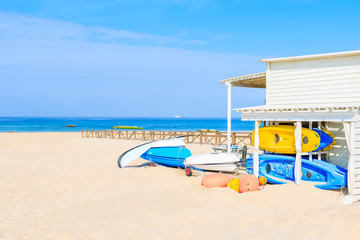 Surfing boards and kayaks on sandy Tarifa beach, Andalusia, Spain