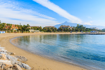 View of beautiful beach with holiday villas on shore near Marbella, Andalusia, Spain