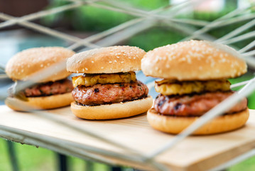 tasty burger on wood board