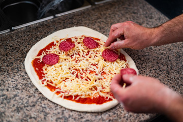Cook making the pizza
