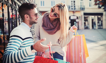 Shopping time. Young couple in shopping. Consumerism, love, dating, lifestyle concept