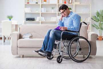 Young student on wheelchair in disability concept