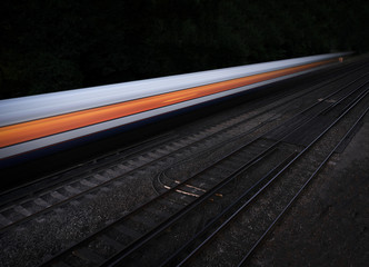 Speeding fast train on an isolated black background