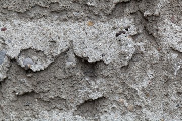 Detail photo of grey rough plaster