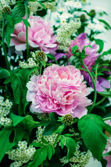 the decor of pink peonies and green leaves