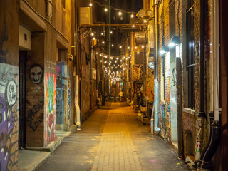 Strong Street Lights and Graffiti Art, Knoxville, Tennessee, United States of America, summer 2018: [Night life in the center of Knoxville] - obrazy, fototapety, plakaty