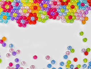 Background of colored beads on a white background
