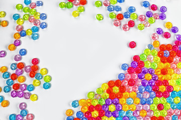 Background of colored beads on a white background