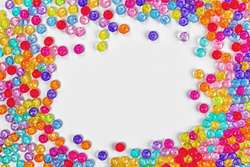 Background of colored beads on a white background