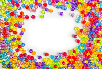Background of colored beads on a white background