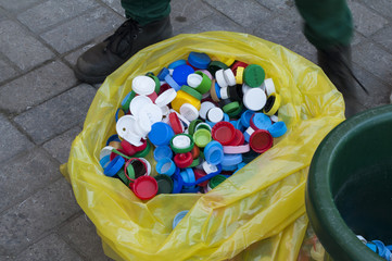 Bag full of bottle caps collected for recycling