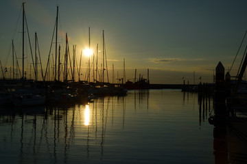 Fototapeta na wymiar Harbour, the boat haven at the sunrise