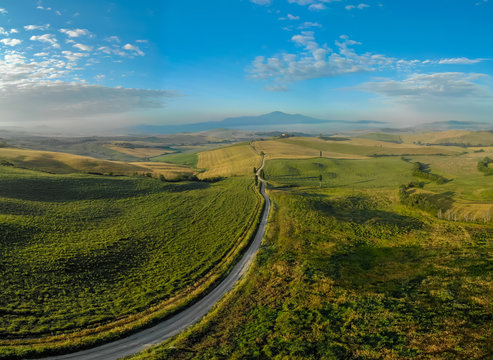 Gladiator Road with cypress trees in the Val d orcia (Orcia Valley) towards Terrapille - near Pienza in Tuscany, Italy - cypress trees along the famous white road, or strada bianca - Aerial view