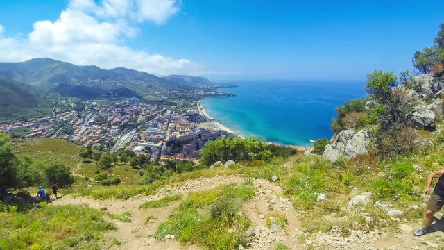 Panoramic aerial view of Cefalu old town, Sicily, Italy. Cefalu is one of the major tourist attractions in the region. Picturesque view from Rocca di Cefalu. Time Lapse. 4K UltraHD