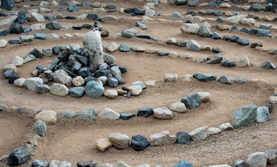 Traditional natural stone walking labyrinth maze made for contemplation and worship, created with...