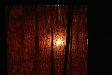 light bulb through the curtain