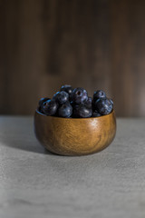 fresh blueberries in a wooden bowl