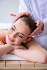 Woman during massage session in spa