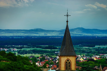 Church belltower on dark sky background before the storm