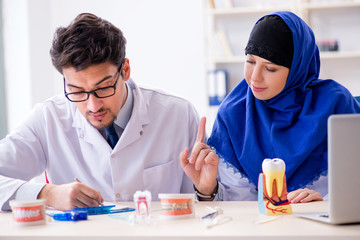 Dentist doctor and assistant working on new tooth implant