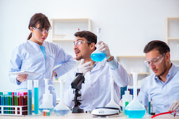Team of chemists working in the lab