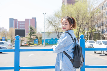 Obraz premium College Girl With Backpack on Campus. Asian chinese college female student 