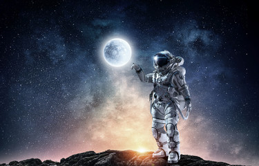 Obraz na płótnie Canvas Spaceman and his mission. Mixed media