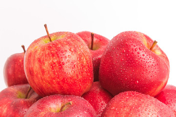 red apple with water drop in closeup shot