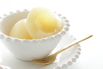 Canned food, peach on bowl for dessert image